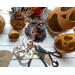 This shows the items I use to make the hats for my Halloween gourds. Items shown are burlap, carved gourds, and botanical pumpkin pods.